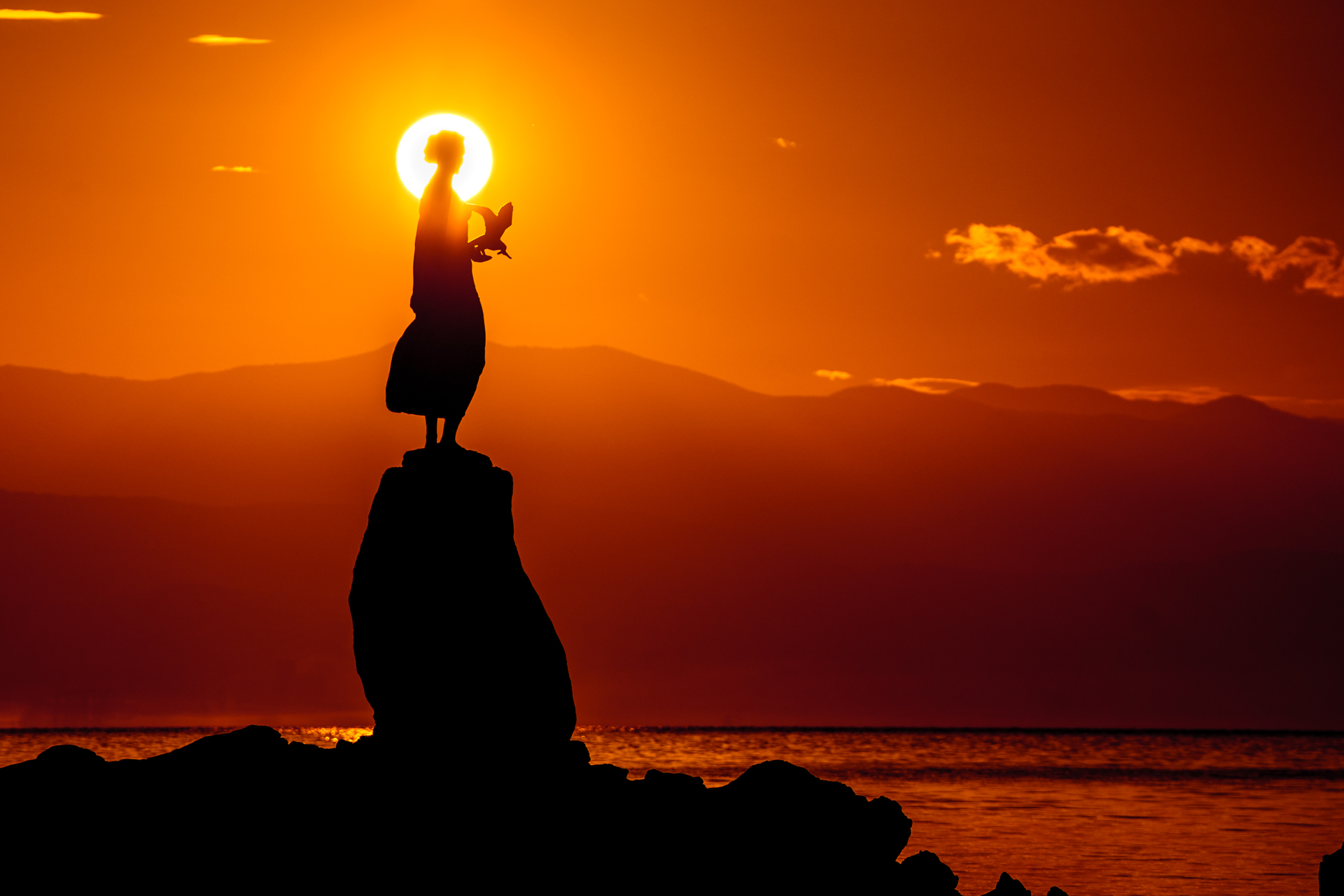 Maiden with the Seagull statue at sunset
