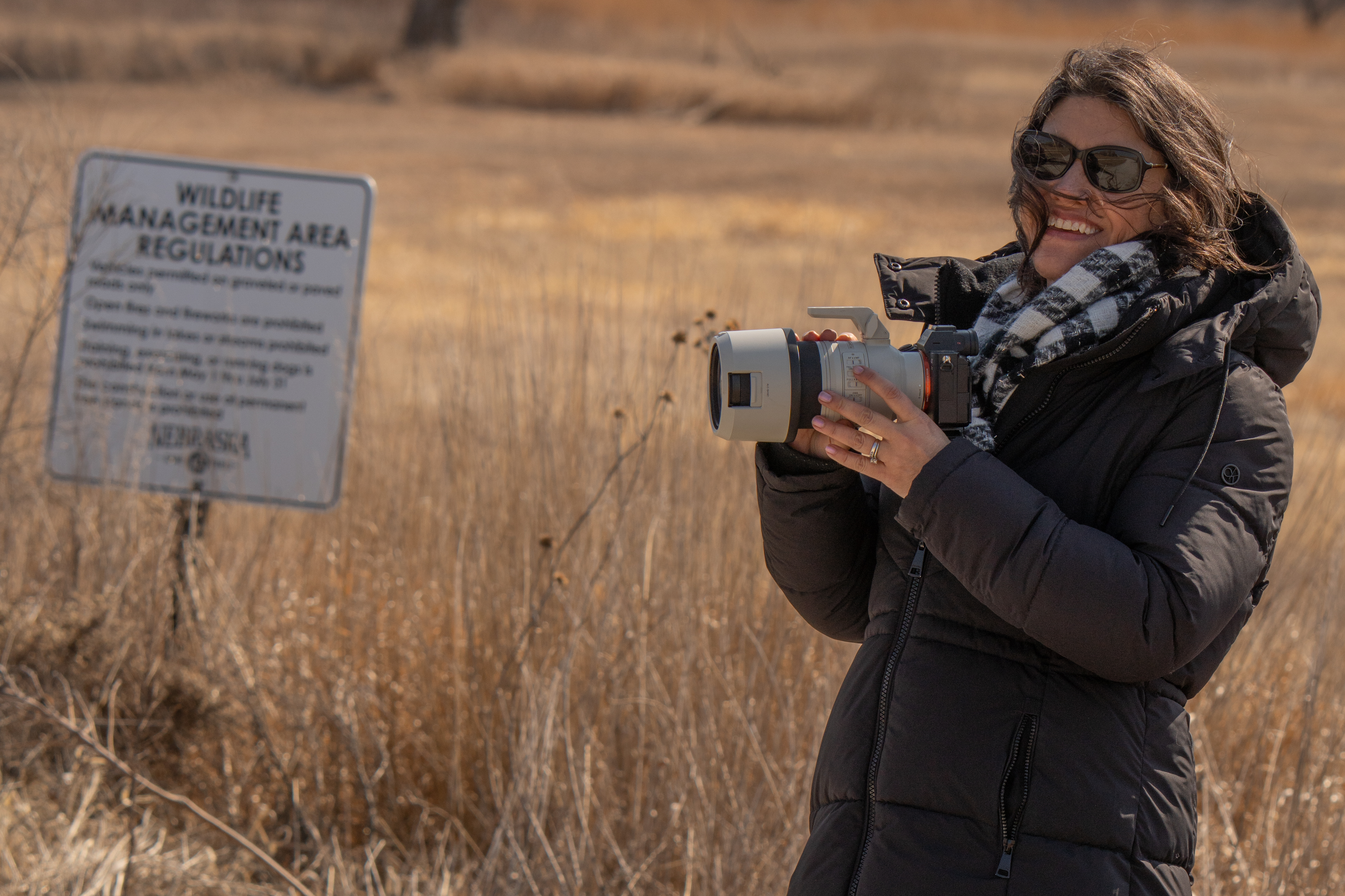 Martha working with a camera in the field